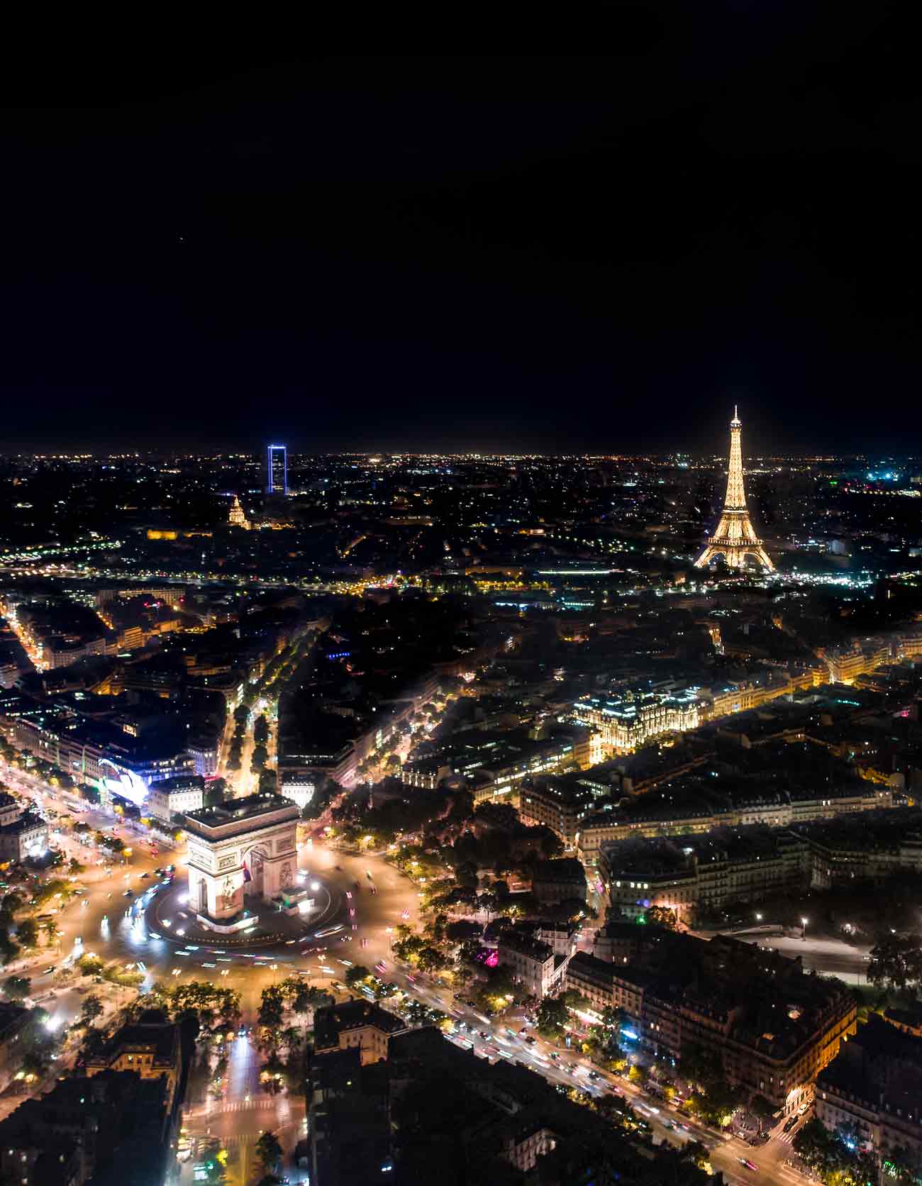 paris city lights at night drone aerial photography