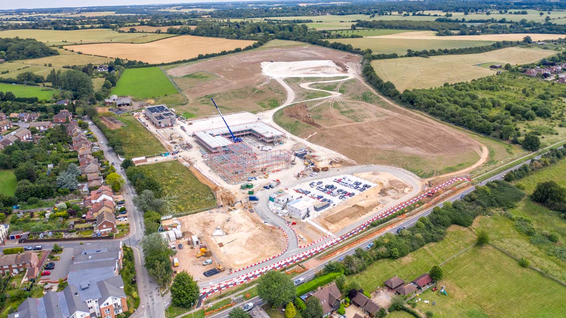 Aerial drone view of construction site progress