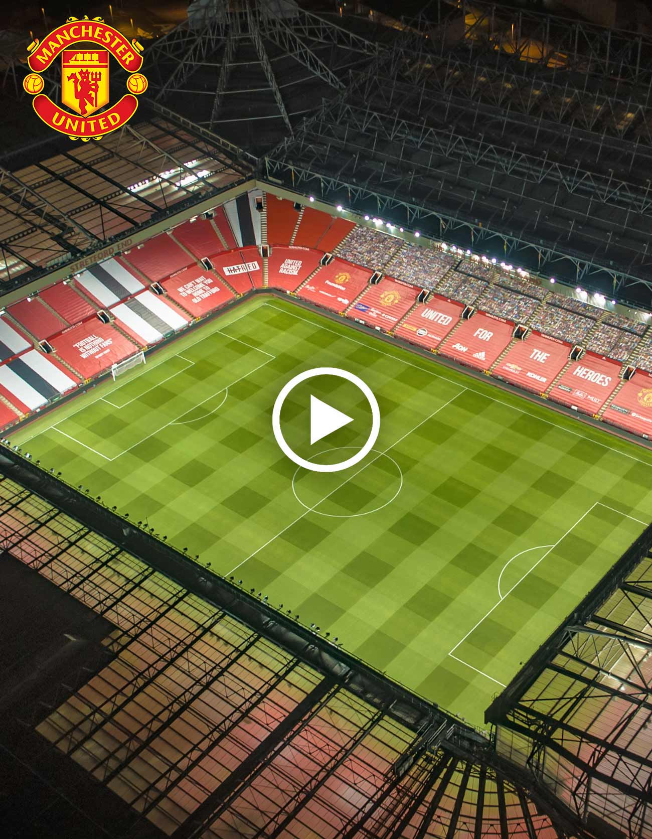 Manchester United stadium at night drone photo
